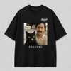 Zwart oversized PABLO T-shirt van FAKESNIFF, print 'copycat': een zwarte kat naast een man met snor voor gestapelde koffiezakken